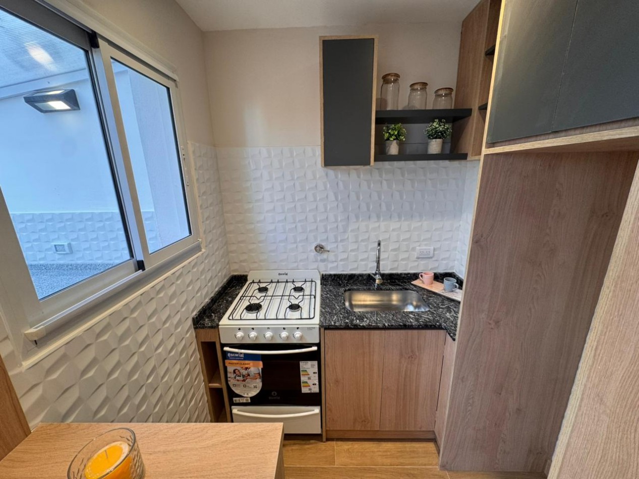 departamento monoambiente contrafrente con patio impecable estado